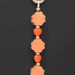 Treccia saponi a fiore arancio decorata